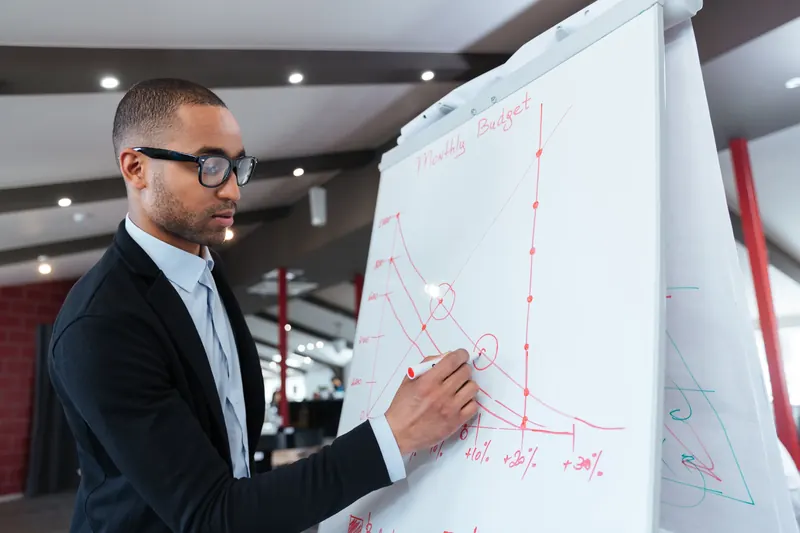 businessman making presentation on the flipchart PV4TGXX